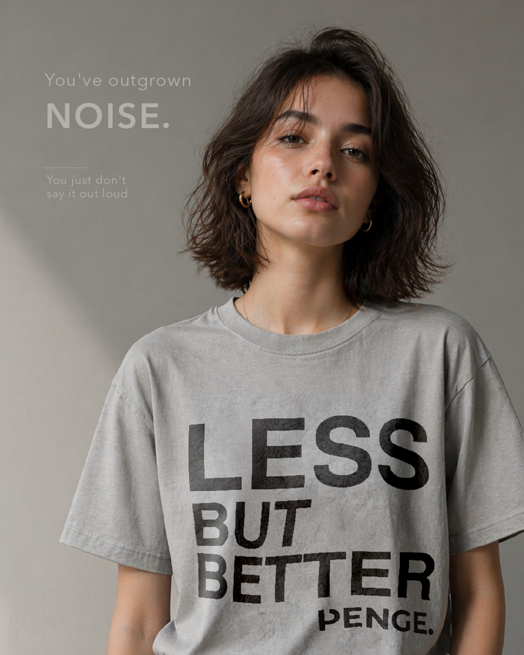 A person wearing the LESS BUT BETTER tee